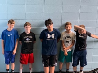 Five 6th grade Youtubers taking a break from streaming to pose for a picture. 