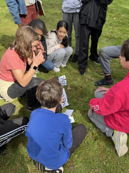Sixth graders attempt to solve one of the many thought-provoking puzzles at their field trip to Yorktown BOCES this past October.