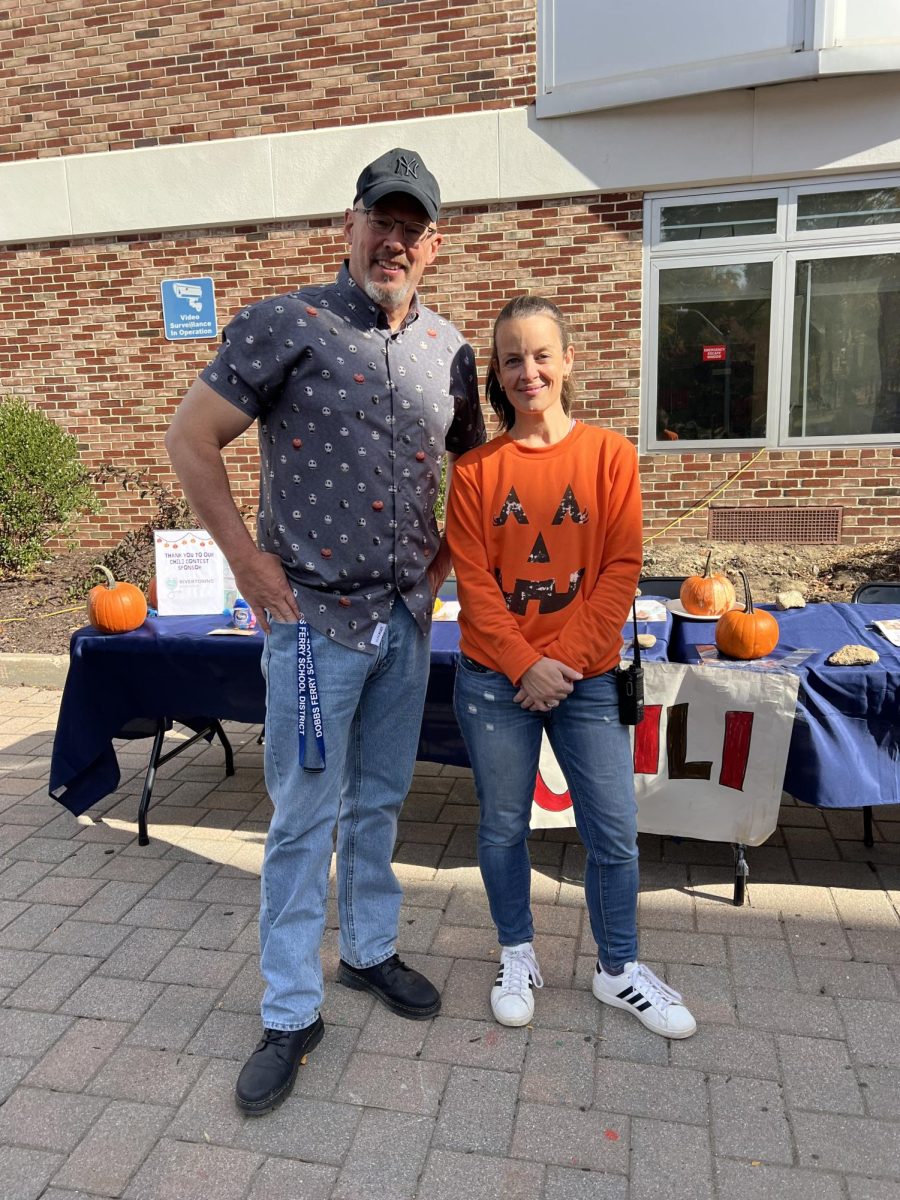 Superintendent of DF Schools Ken Slentz joins PTSA President Alice Dabiri for a picture while enjoying the festivities at the annual Pumpkin Fair.